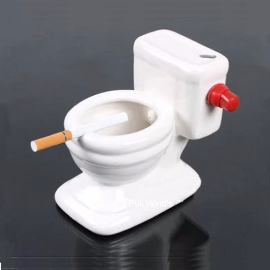 Funny toilet ashtray that sprays water