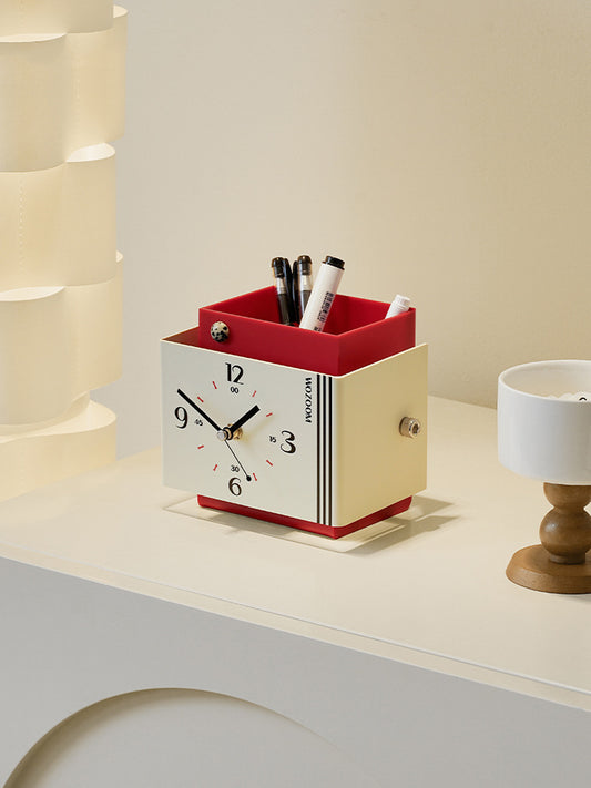 Creative art style clock with pen holder function