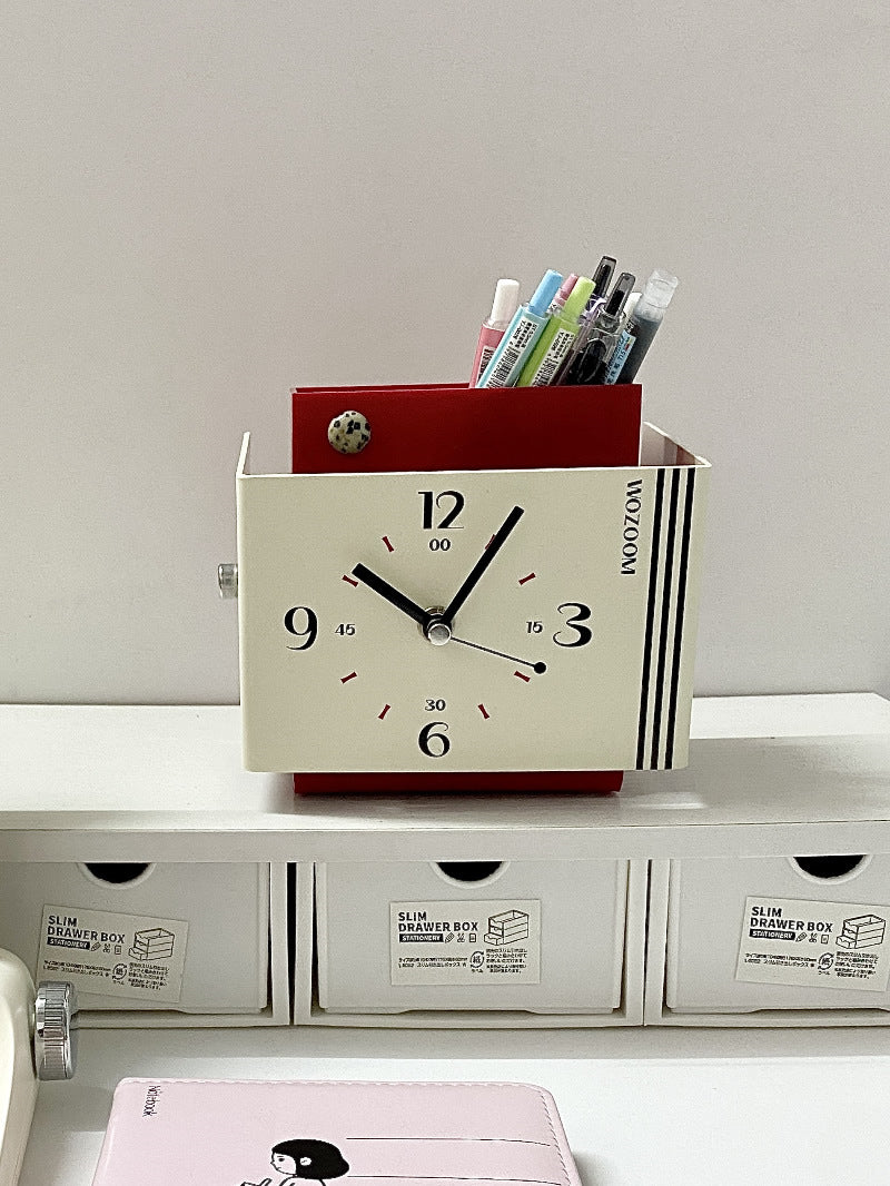 Creative art style clock with pen holder function